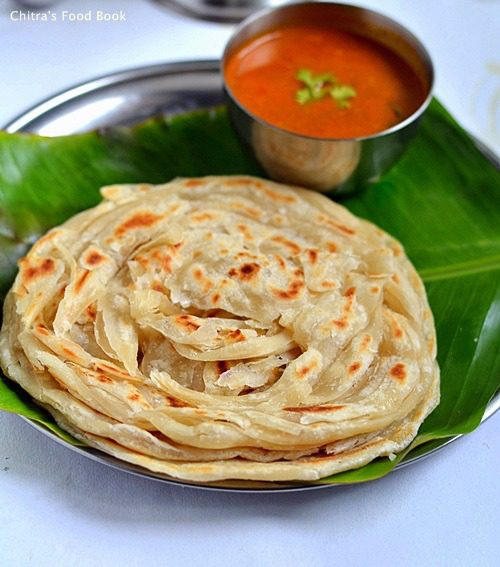 Tandori Chapati kept on banana leaf in a plate with soup.